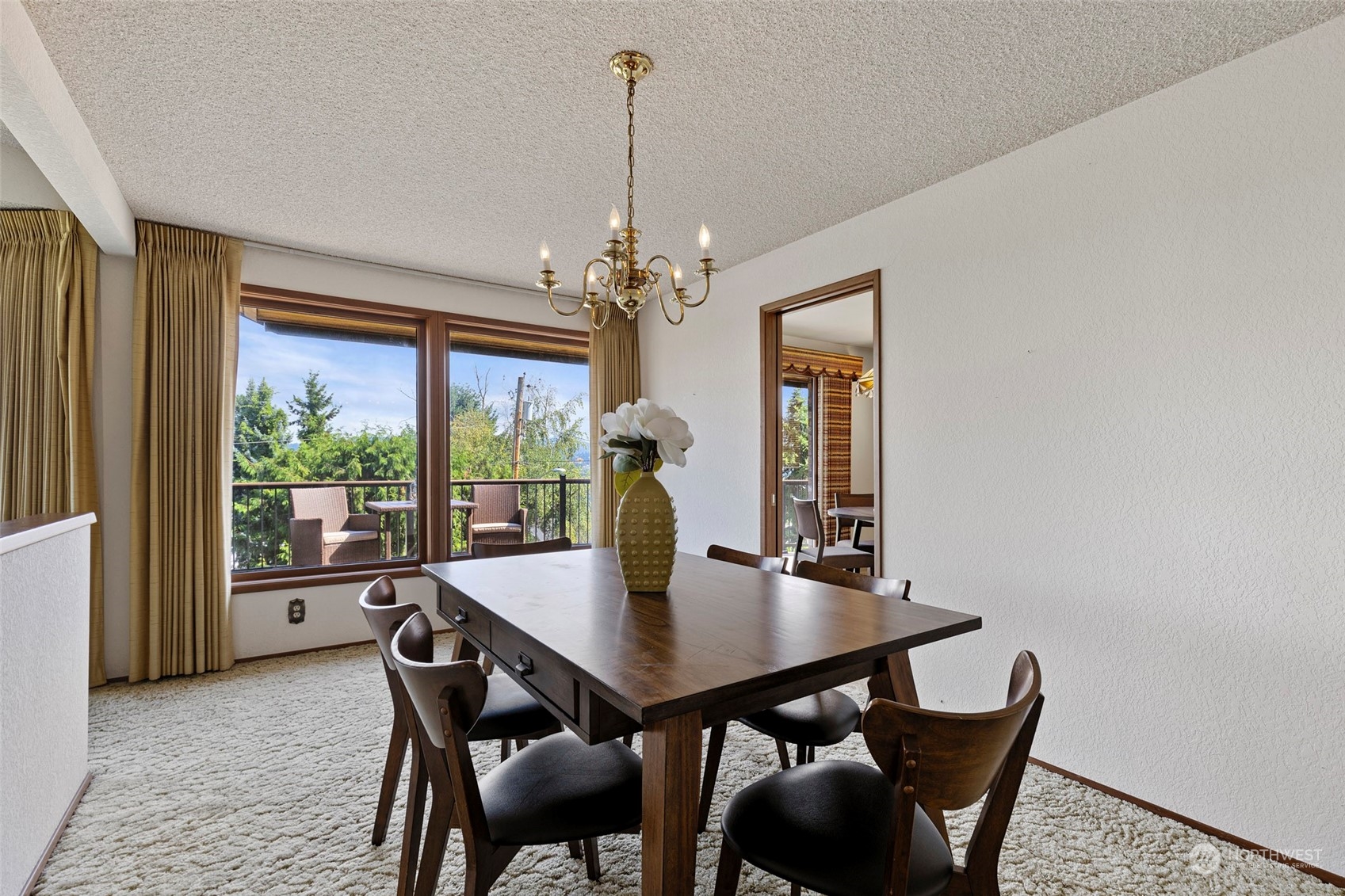 411 Seneca Court Northwest Renton, WA 98057 - Photo 22 of 37 a view of a dining room with furniture window and outside view