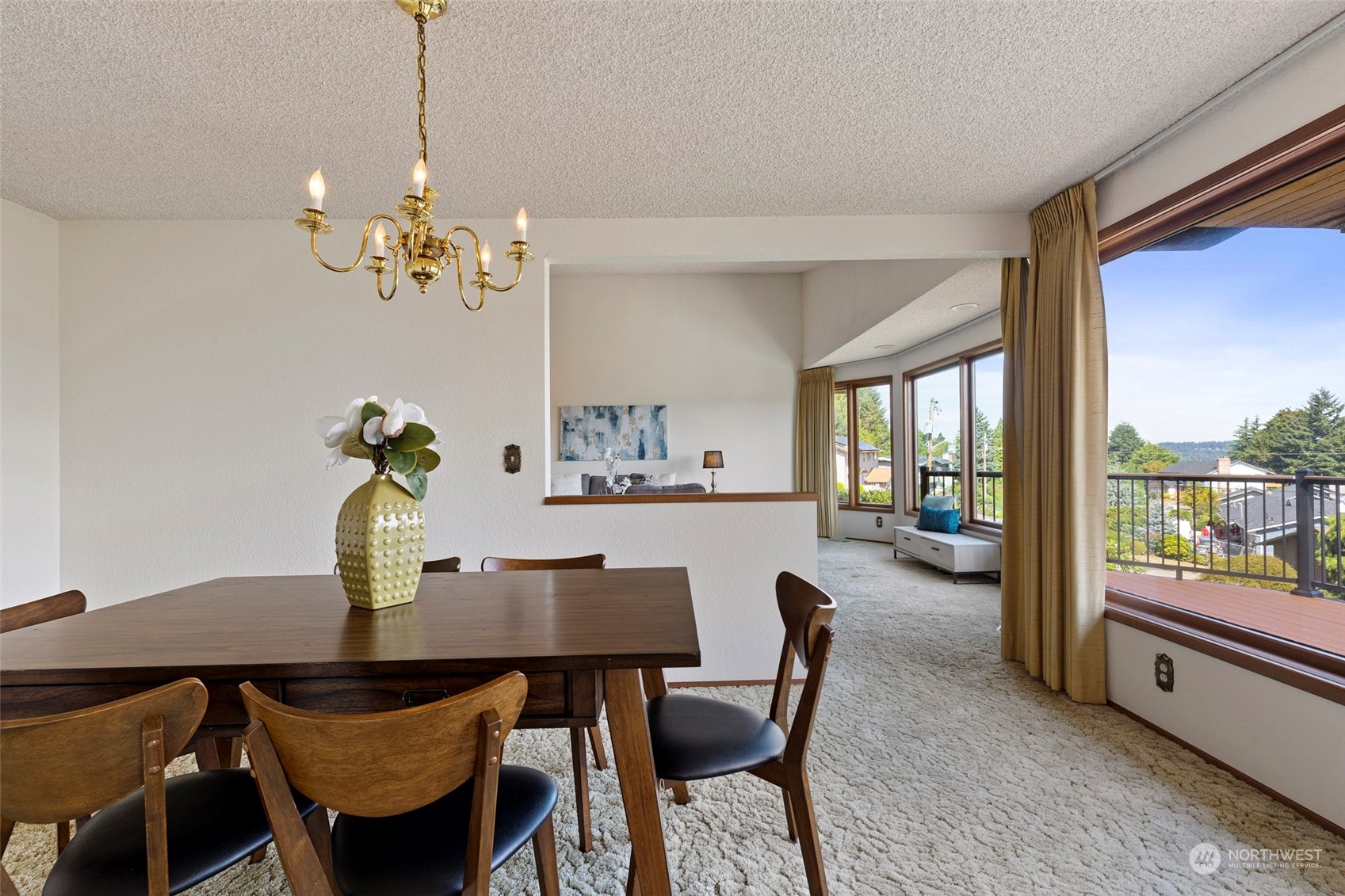 411 Seneca Court Northwest Renton, WA 98057 - Photo 23 of 37 a view of a dining room with furniture a chandelier and wooden floor