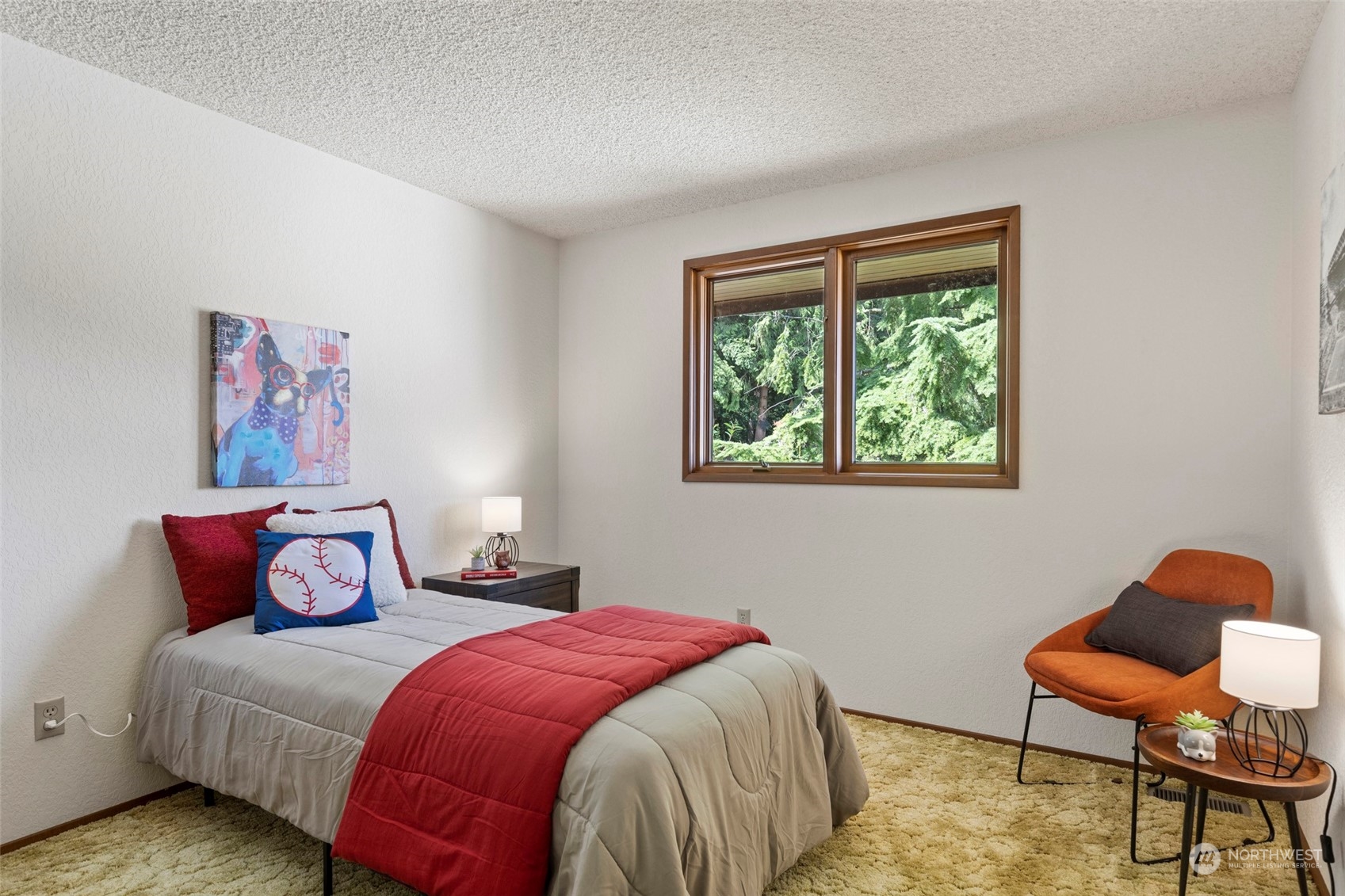 411 Seneca Court Northwest Renton, WA 98057 - Photo 27 of 37 a bedroom with a bed and chair