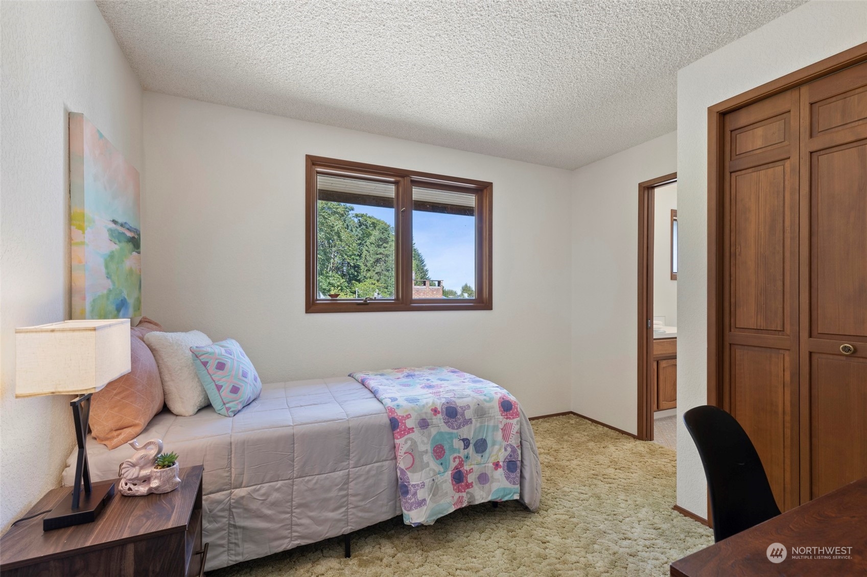 411 Seneca Court Northwest Renton, WA 98057 - Photo 28 of 37 a bedroom with a bed and wooden floor