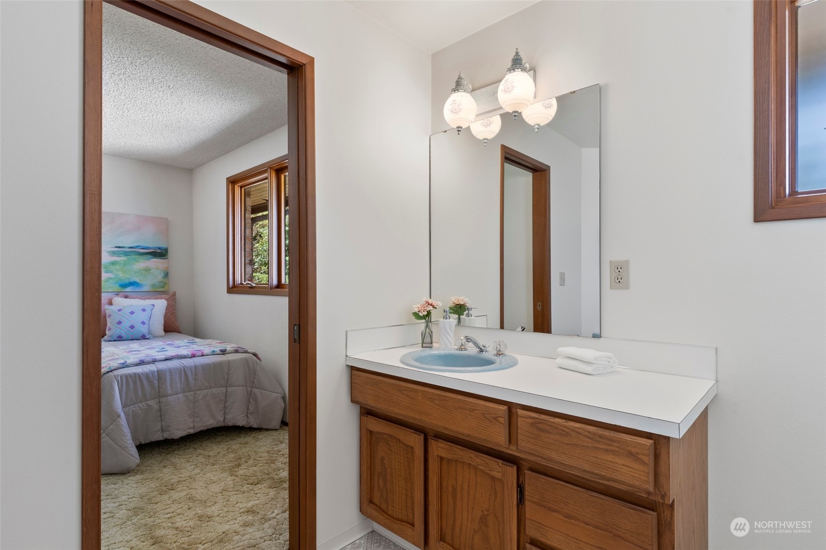 411 Seneca Court Northwest Renton, WA 98057 - Photo 29 of 37 a en suite bathroom with a double vanity sink and a mirror