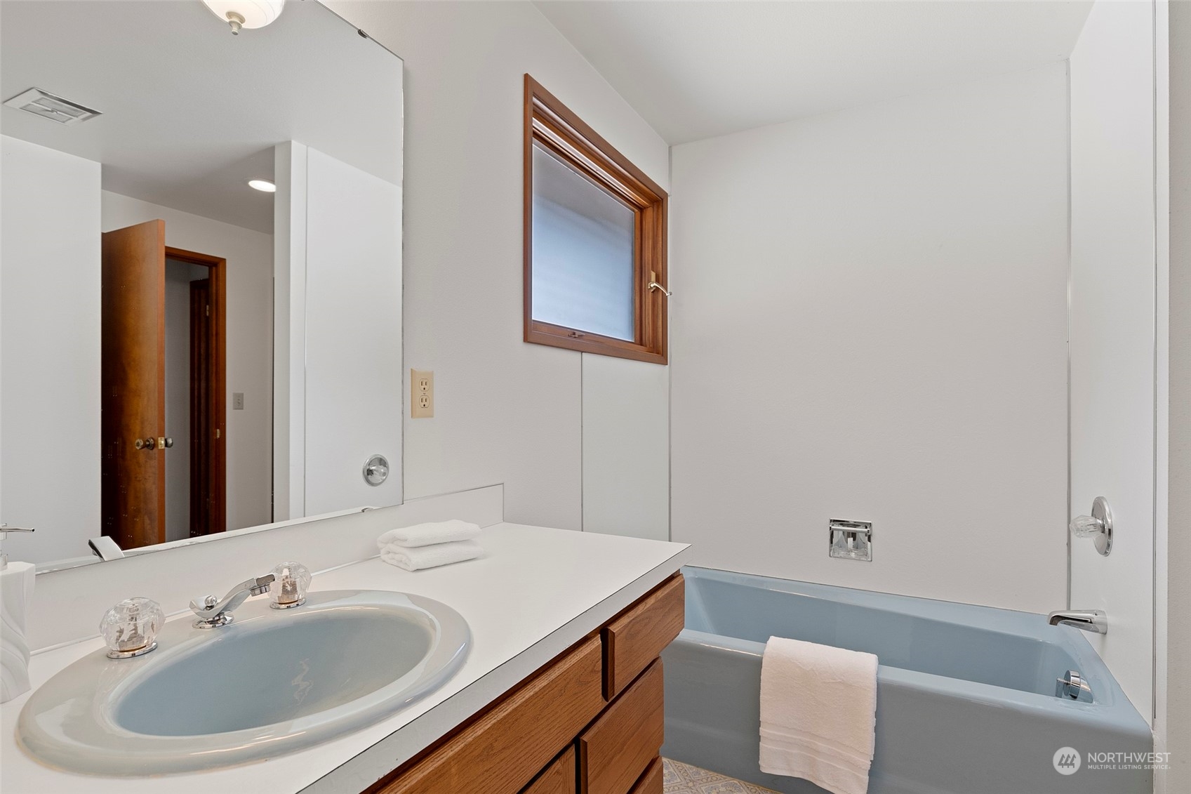 411 Seneca Court Northwest Renton, WA 98057 - Photo 31 of 37 a bathroom with a sink and a mirror