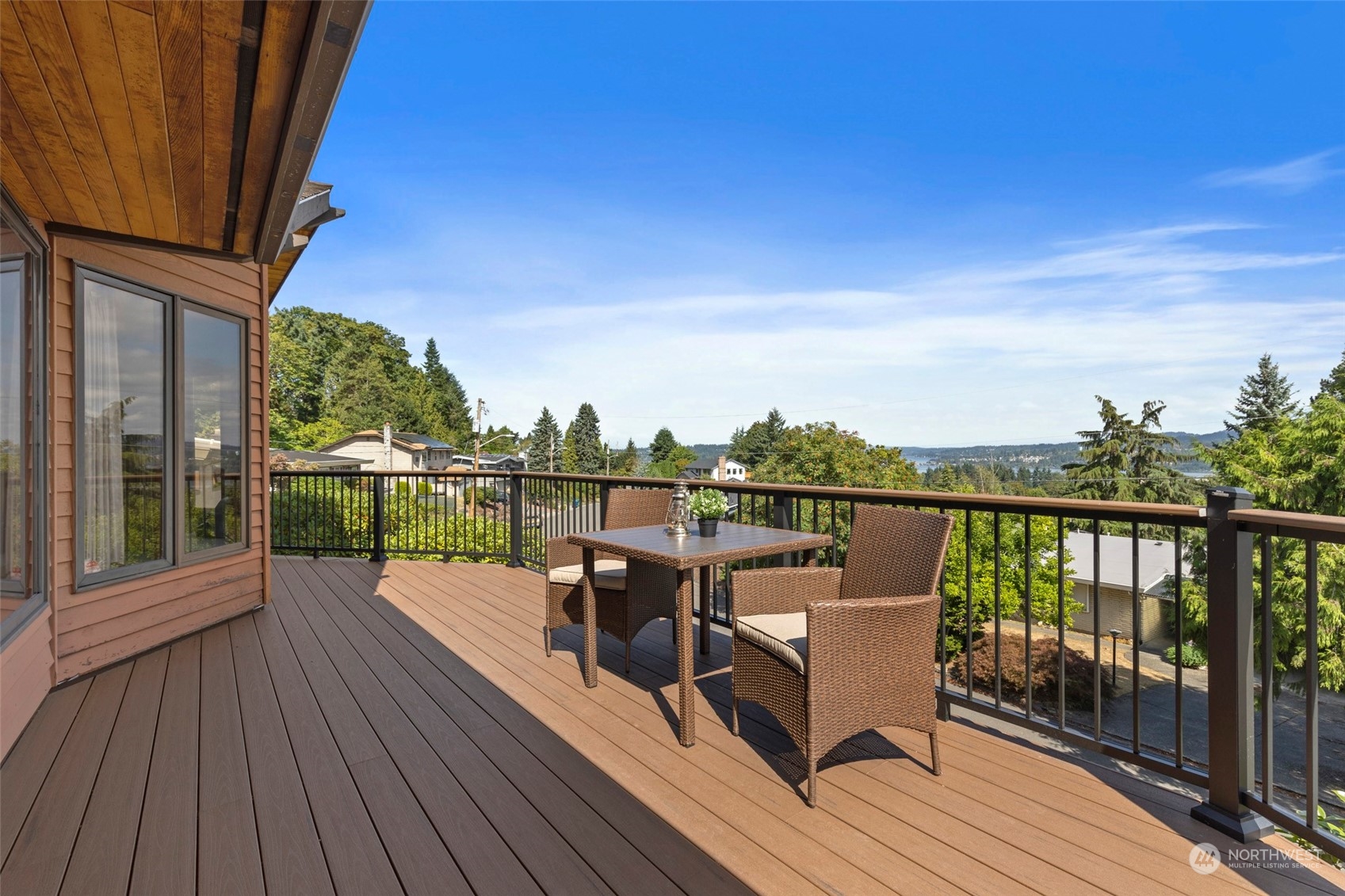 411 Seneca Court Northwest Renton, WA 98057 - Photo 32 of 37 a view of a balcony with two chairs and wooden floor