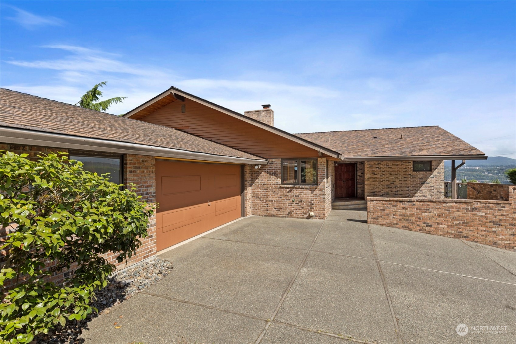 411 Seneca Court Northwest Renton, WA 98057 - Photo 34 of 37 a view of a house with a yard and potted plants
