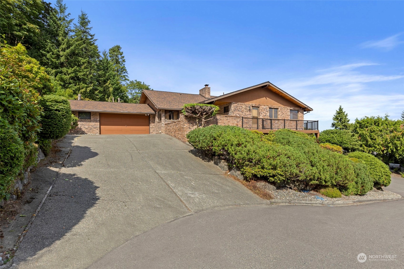 411 Seneca Court Northwest Renton, WA 98057 - Photo 37 of 37 a front view of a house with a yard and garage