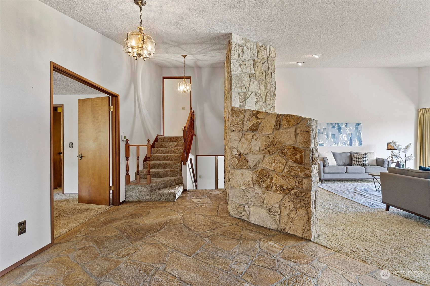 411 Seneca Court Northwest Renton, WA 98057 - Photo 4 of 37 a view of a livingroom with furniture and staircase