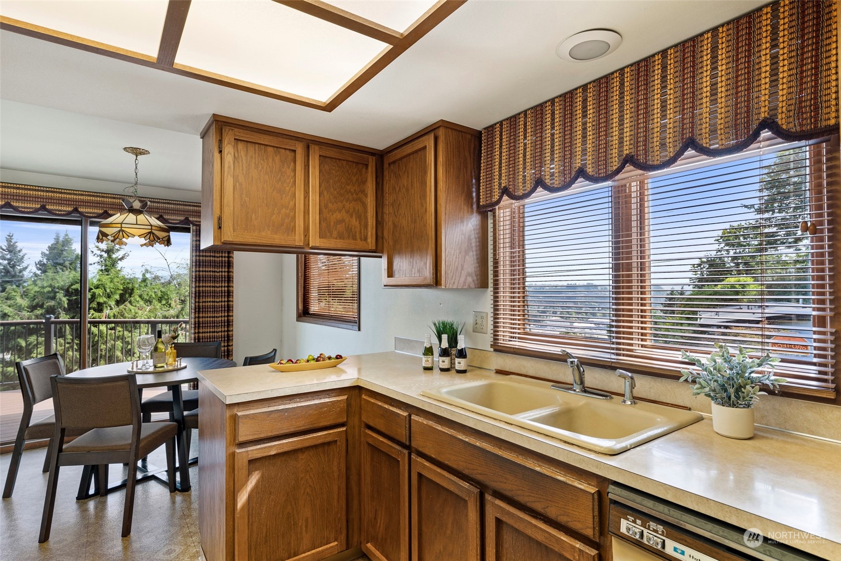 411 Seneca Court Northwest Renton, WA 98057 - Photo 9 of 37 a kitchen with a sink and a window