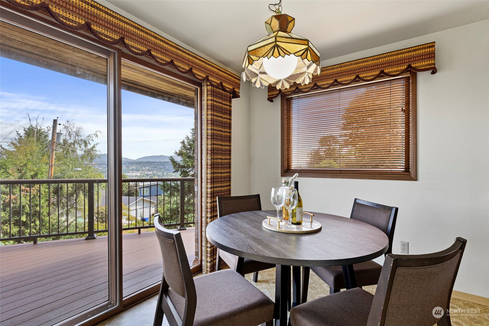 411 Seneca Court Northwest Renton, WA 98057 - Photo 10 of 37 a view of a dining room with furniture window and outside view
