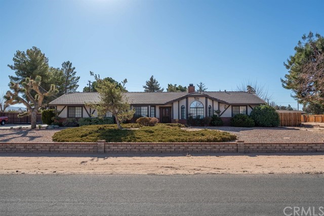 20293 Itasca Road Apple Valley, CA 92308 - Photo 1 of 1 a front view of a house with a yard