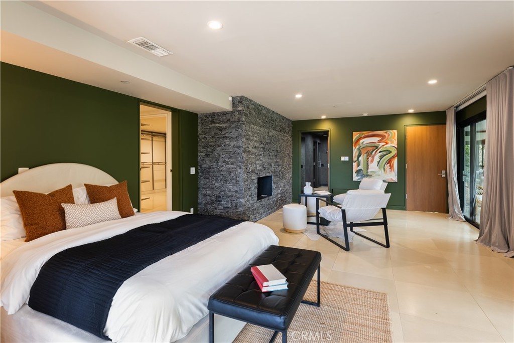 21656 Las Flores Heights Road Malibu, CA 90265 - Photo 31 of 71 Downstairs primary suite w/ fireplace