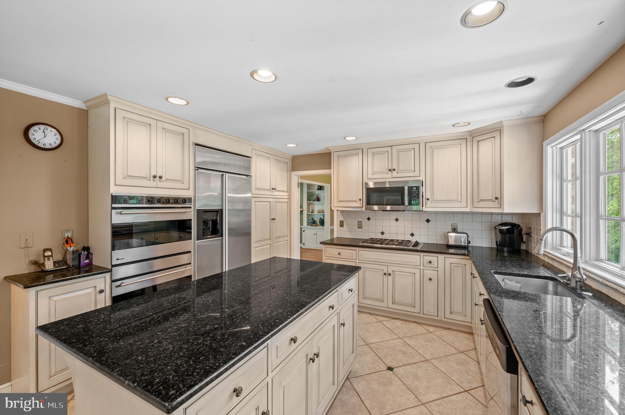 211 Spruce Tree Road Wayne, PA 19087 - Photo 11 of 44 a kitchen with stainless steel appliances granite countertop a sink stove and refrigerator