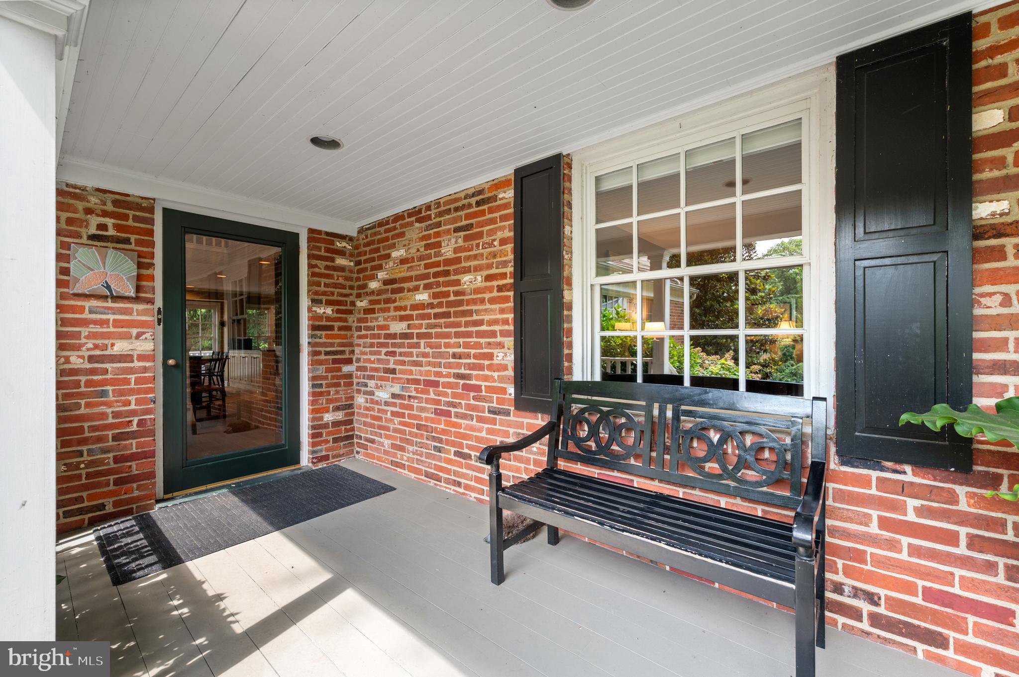 211 Spruce Tree Road Wayne, PA 19087 - Photo 2 of 44 a bench sitting in front of a building