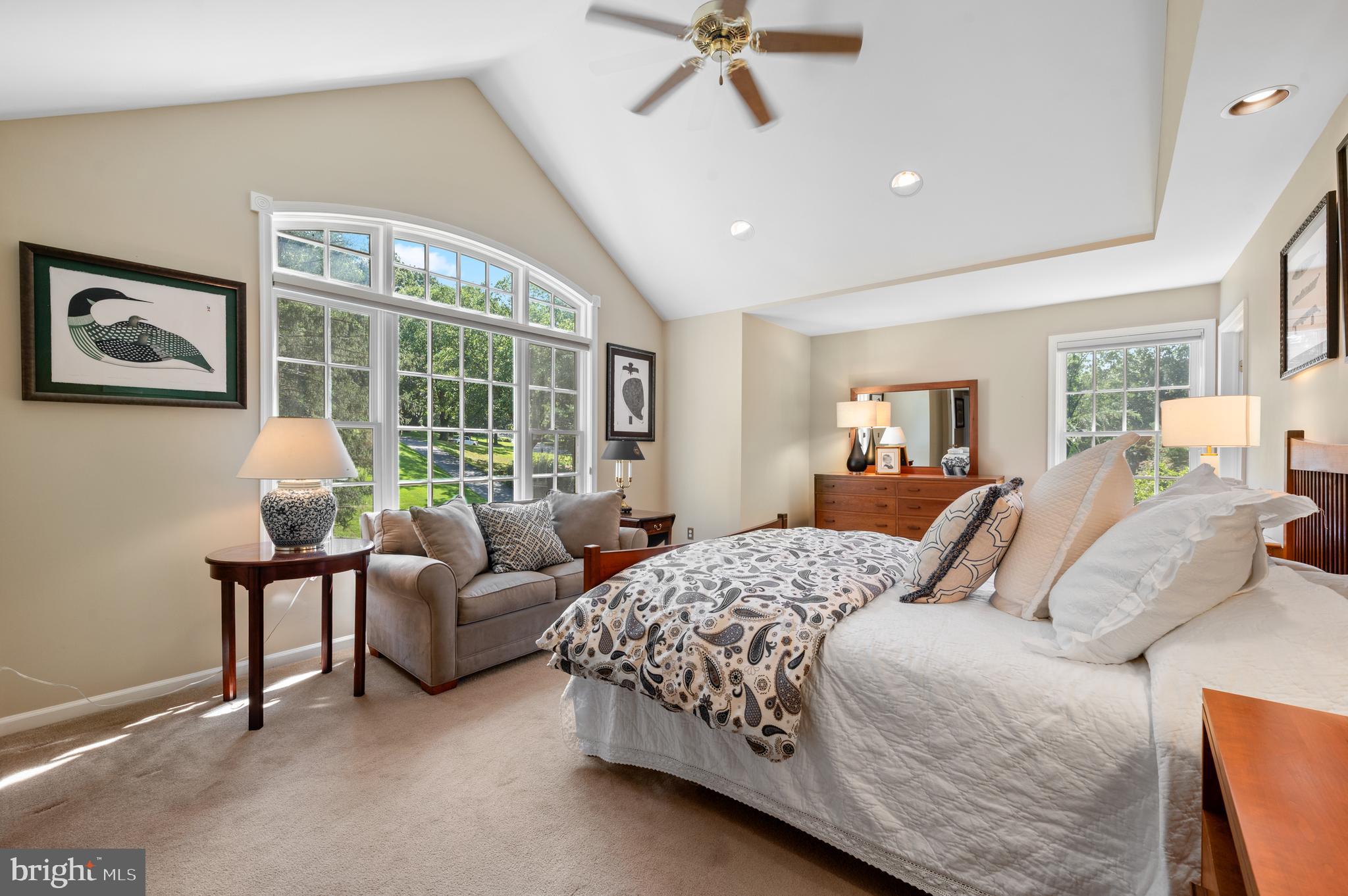 211 Spruce Tree Road Wayne, PA 19087 - Photo 22 of 44 a bedroom with a bed couches chair and a large window