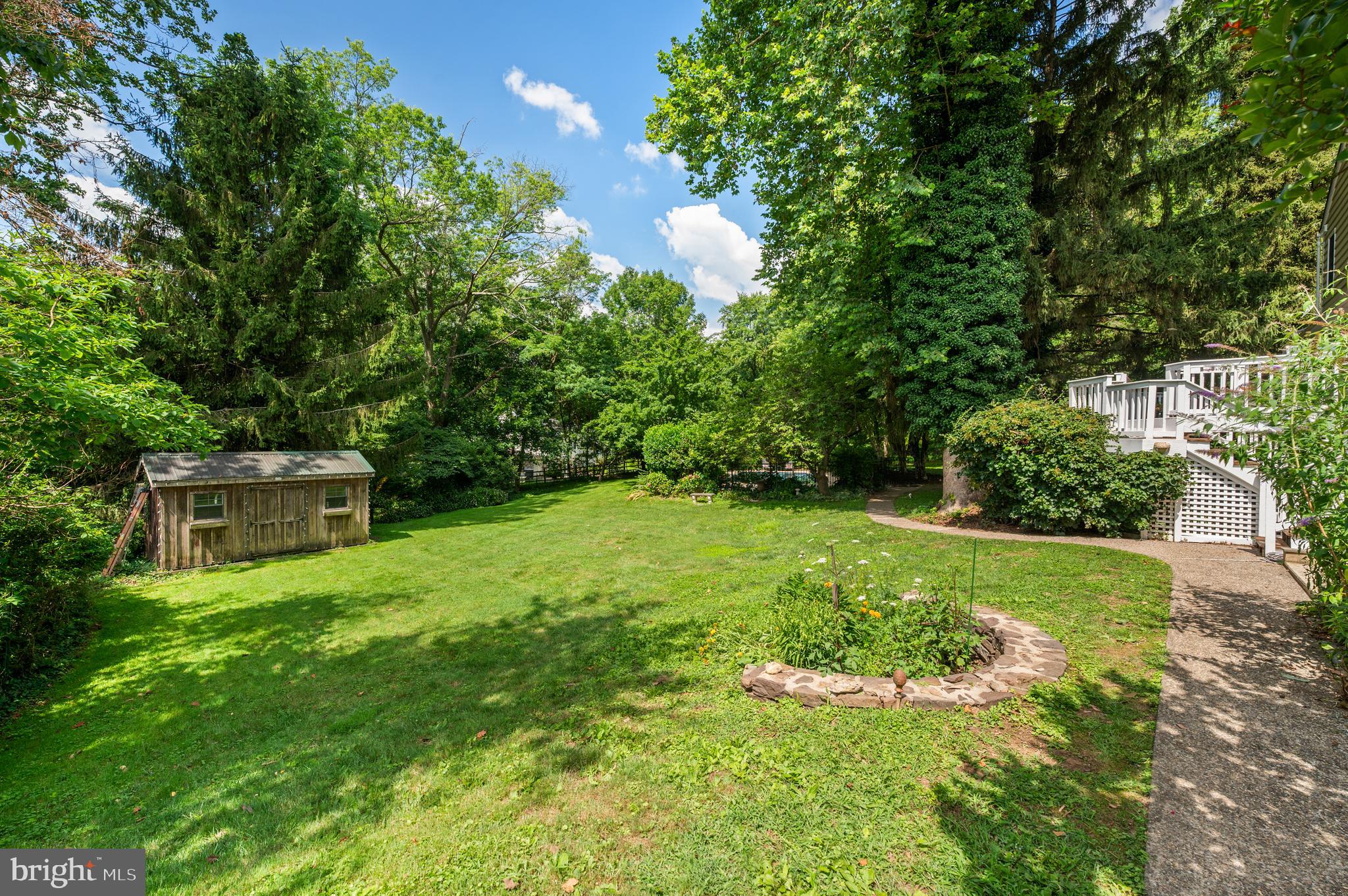 211 Spruce Tree Road Wayne, PA 19087 - Photo 43 of 44 a backyard of a house with lots of green space