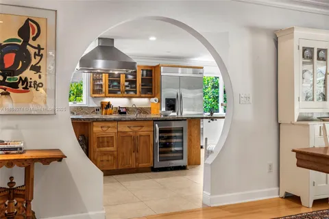 a bed room with a bed window and a dresser