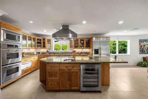 a living room with a bed furniture and a window