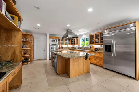a bathroom with a granite countertop sink mirror and shower