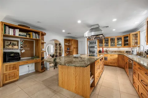 a spacious bathroom with a granite countertop sink mirror and shower