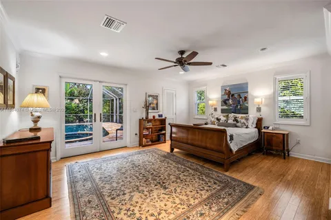 a view of bathroom with a sink mirror and shower