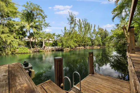 a view of a backyard with sitting area