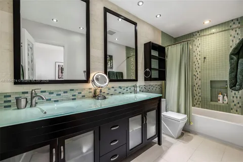 an aerial view of a house with swimming pool outdoor seating and yard