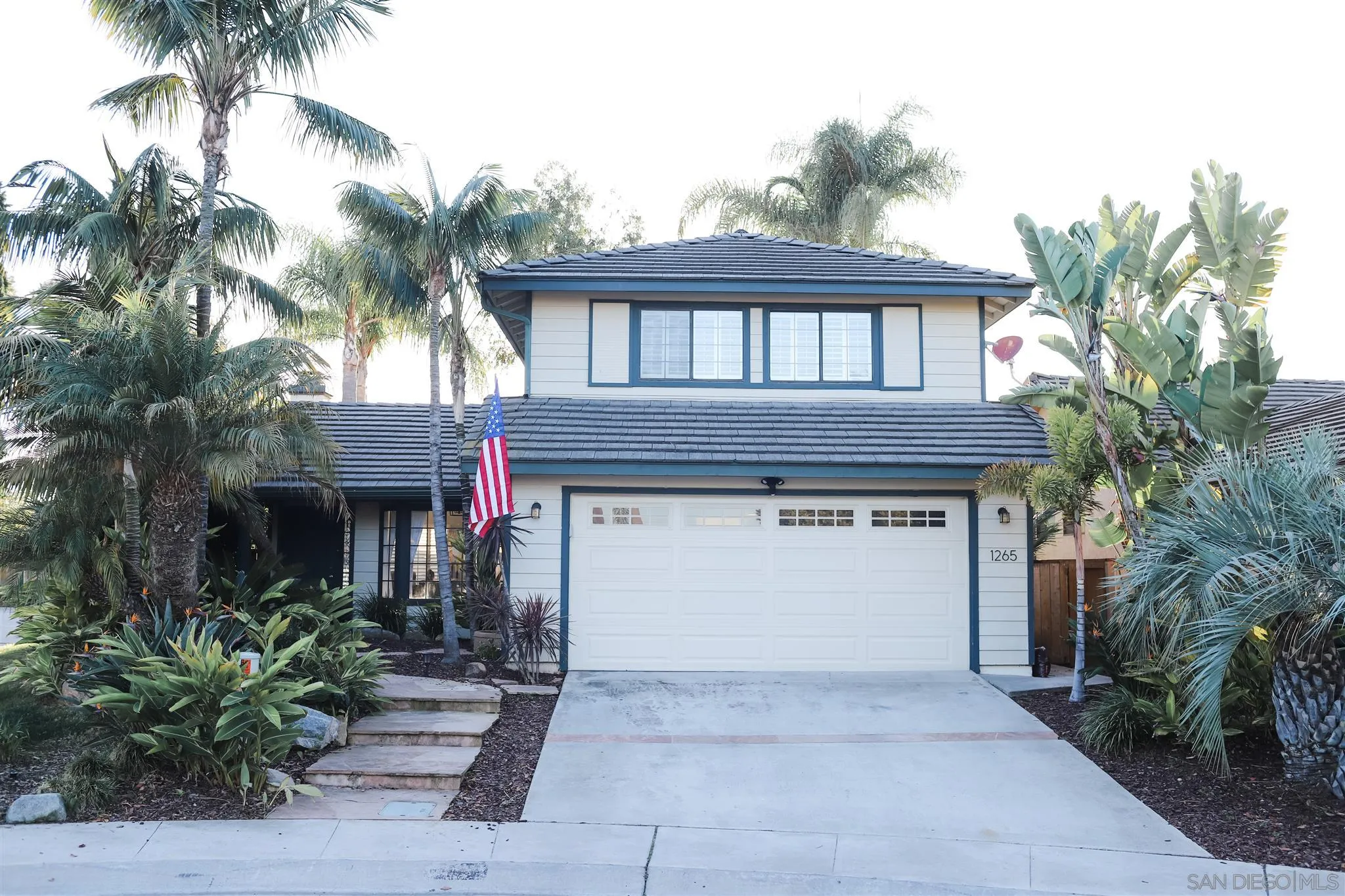 a front view of a house with a garage