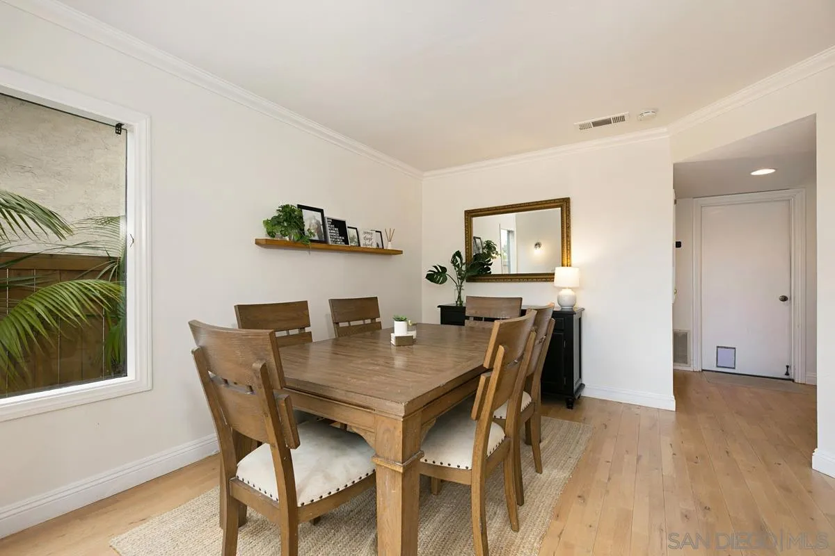1265 Longfellow Road Vista, CA 92081 - Photo 14 of 28 a view of a dining room with furniture and wooden floor