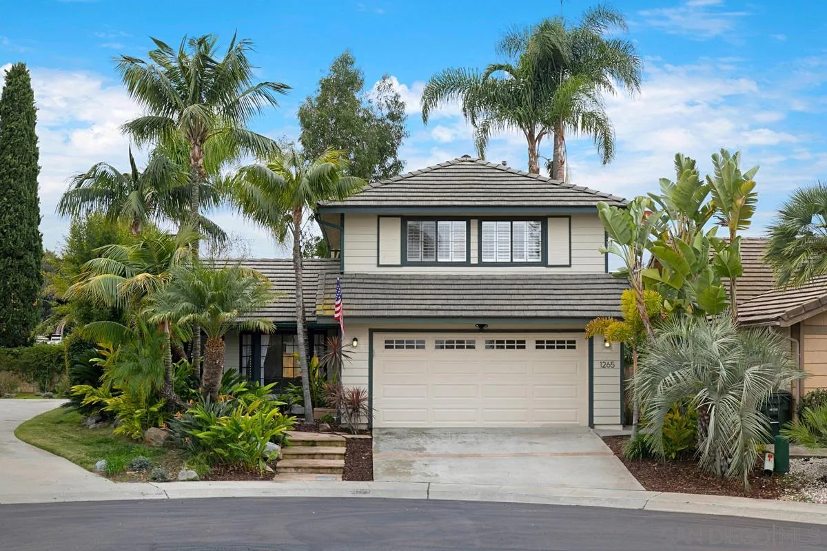 1265 Longfellow Road Vista, CA 92081 - Photo 2 of 28 a front view of a house with a garden