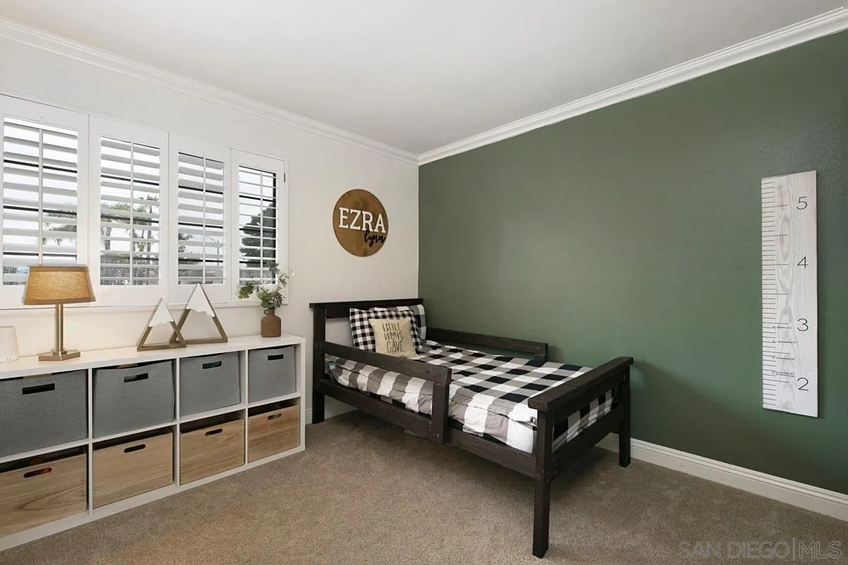 1265 Longfellow Road Vista, CA 92081 - Photo 21 of 28 a bedroom with furniture and a window