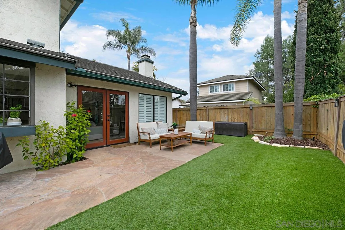 1265 Longfellow Road Vista, CA 92081 - Photo 24 of 28 a view of a house with backyard sitting area and garden
