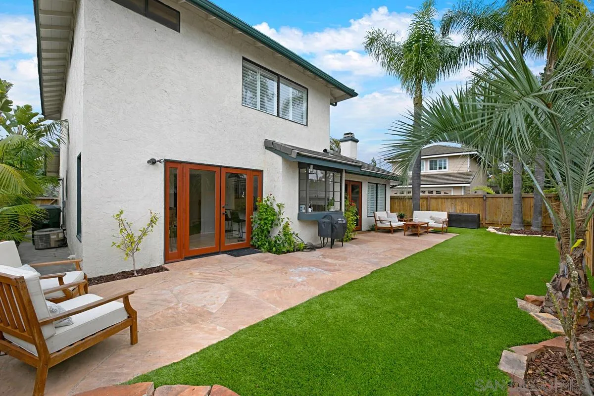 1265 Longfellow Road Vista, CA 92081 - Photo 26 of 28 a front view of a house with a garden and patio