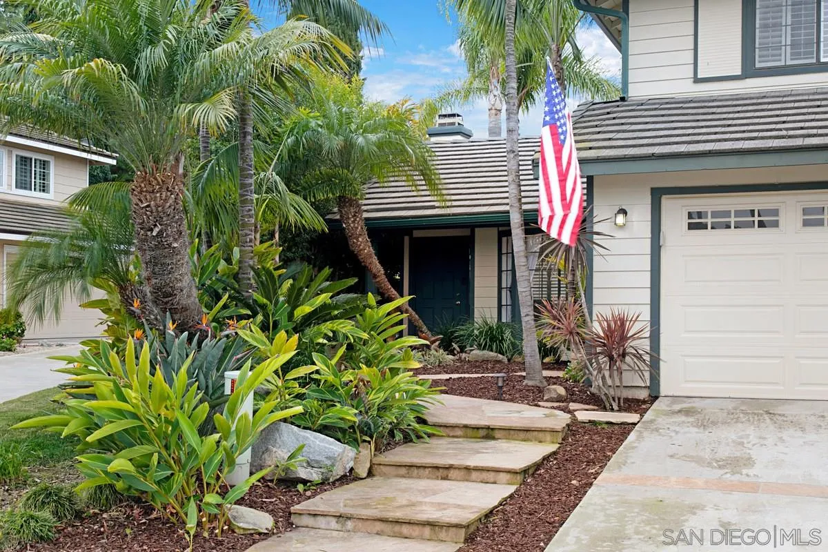 1265 Longfellow Road Vista, CA 92081 - Photo 3 of 28 a front view of a house with a yard