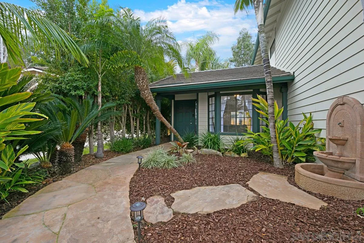 1265 Longfellow Road Vista, CA 92081 - Photo 4 of 28 a front view of a house with garden