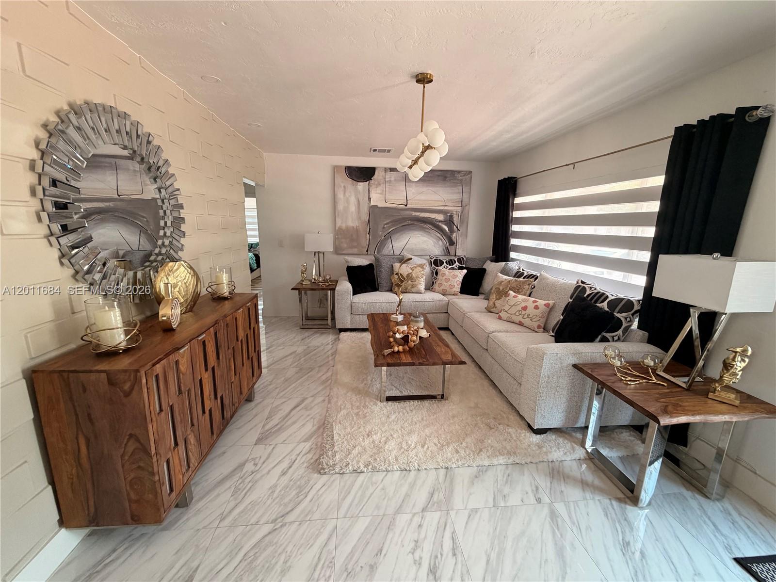 315 West 62nd Street Hialeah, FL 33012 - Photo 4 of 21 a living room with furniture and a wooden floor