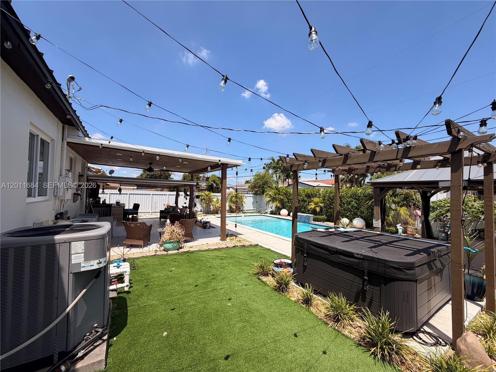 315 West 62nd Street Hialeah, FL 33012 - Photo 9 of 21 a view of a backyard with sitting area