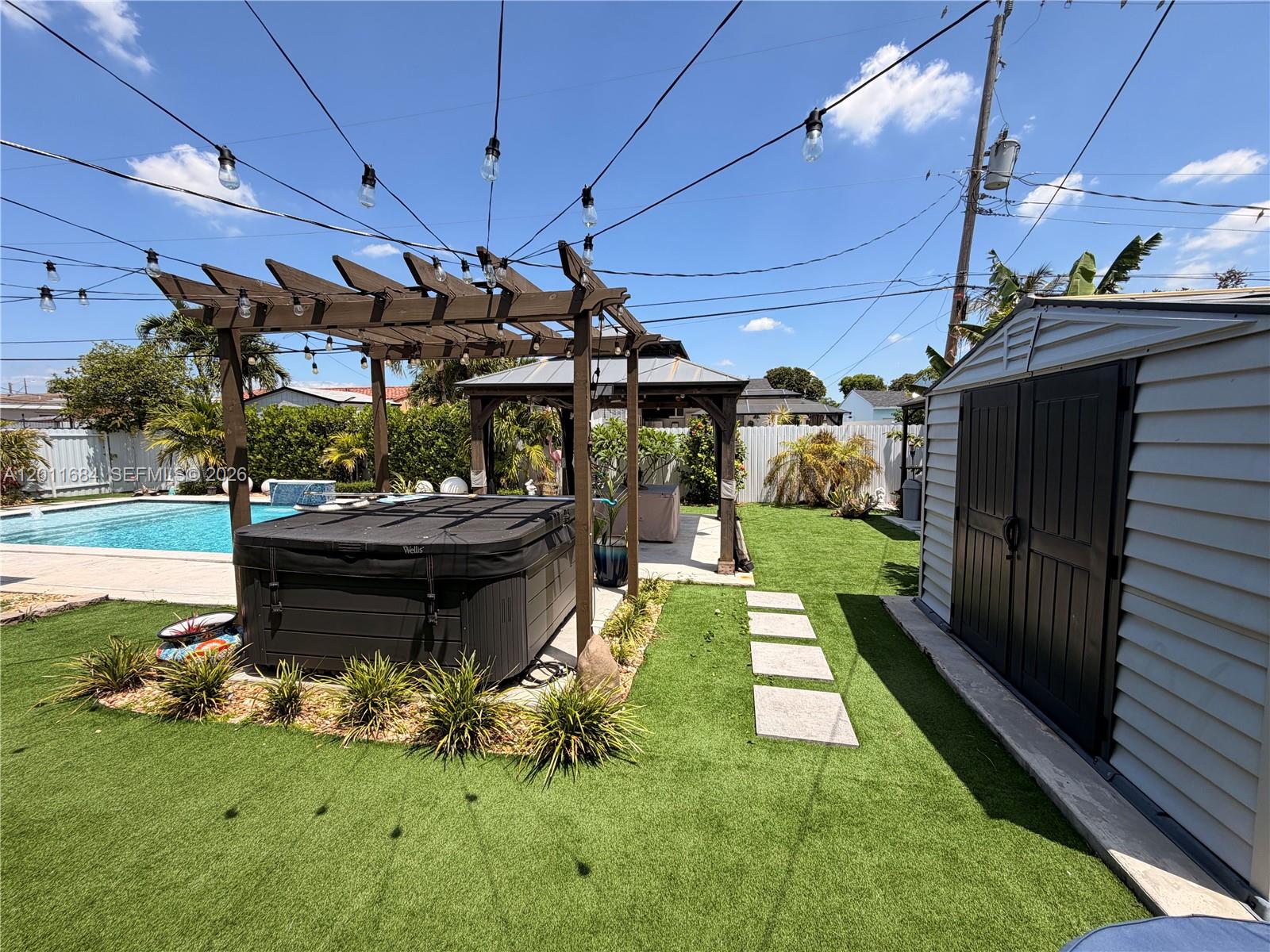 315 West 62nd Street Hialeah, FL 33012 - Photo 10 of 21 a view of a backyard with sitting area
