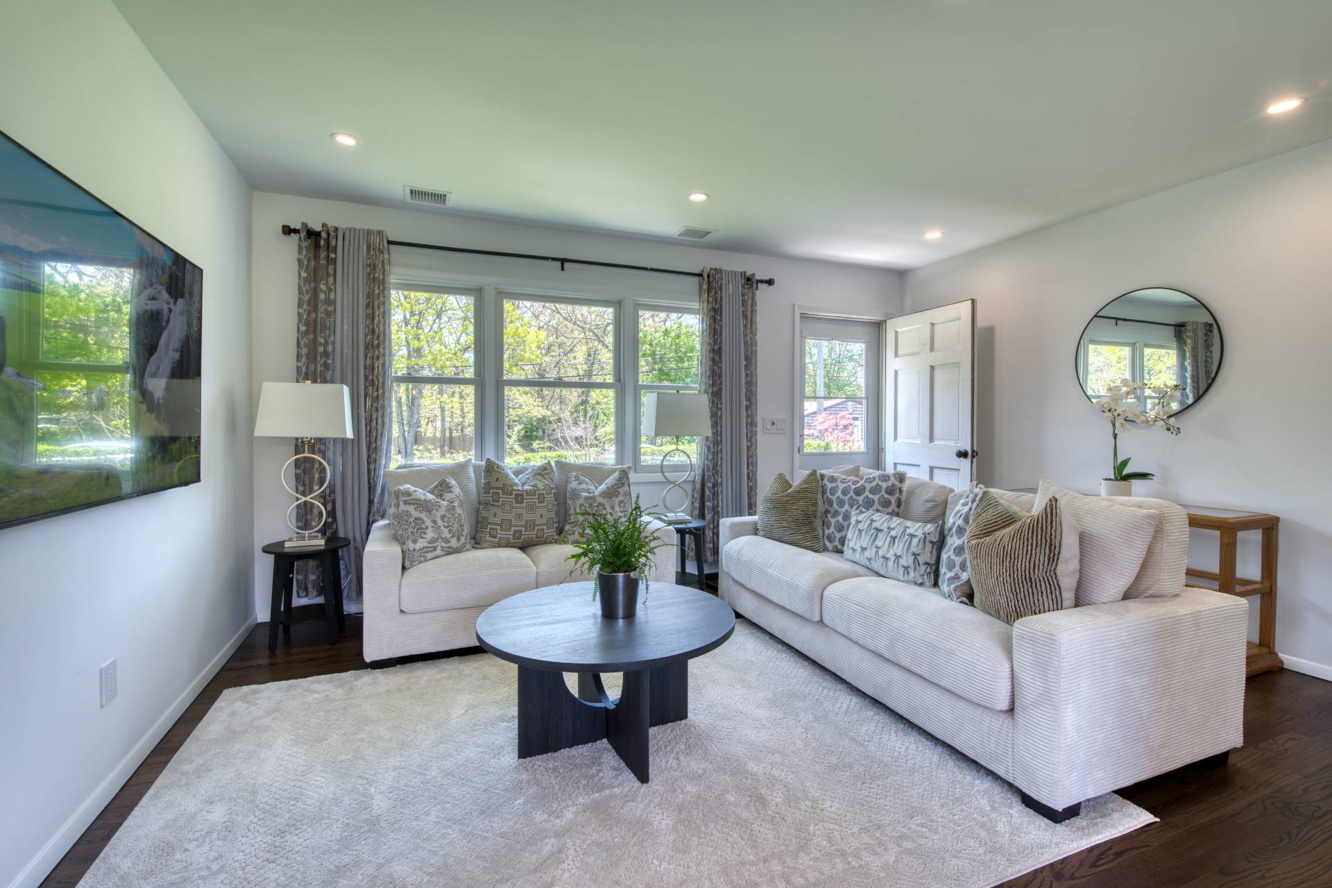 88 Old Country Road East Quogue, NY 11942 - Photo 2 of 10 a living room with furniture and a large window