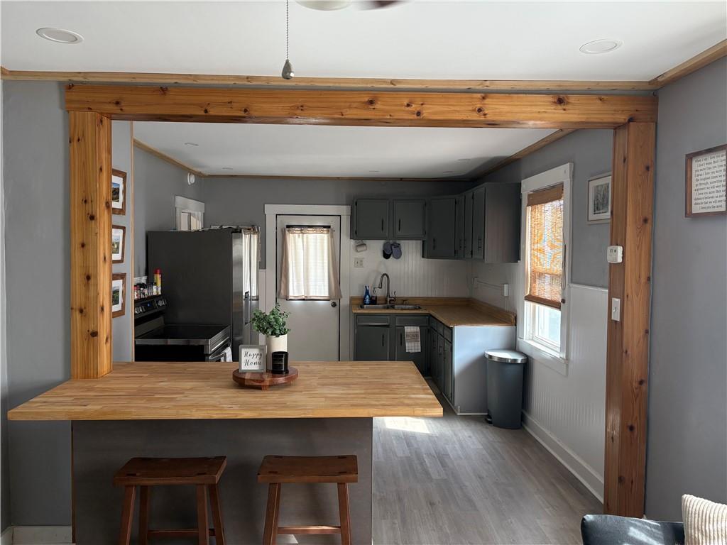 2283 Sandy Plains Road Clarksville, PA 15322 - Photo 2 of 18 a kitchen with kitchen island a sink stainless steel appliances and cabinets