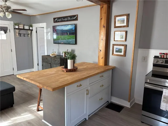 a view of kitchen island with furniture and wooden floor