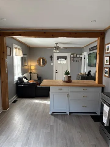 a living room with furniture and a large mirror