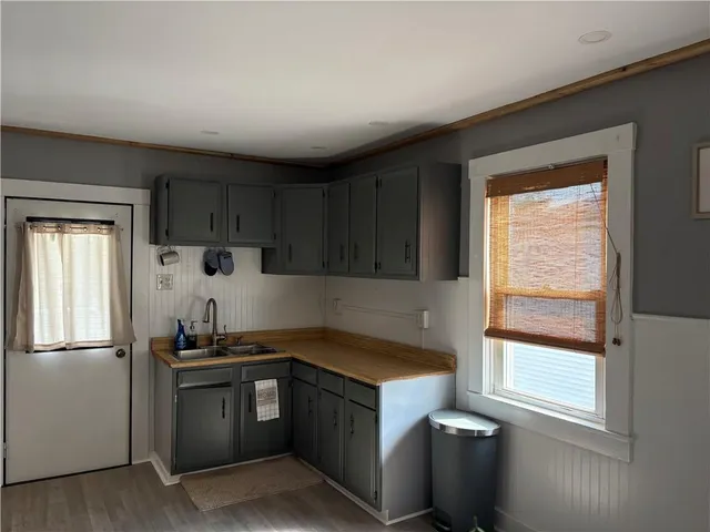 a kitchen with a refrigerator stove and sink