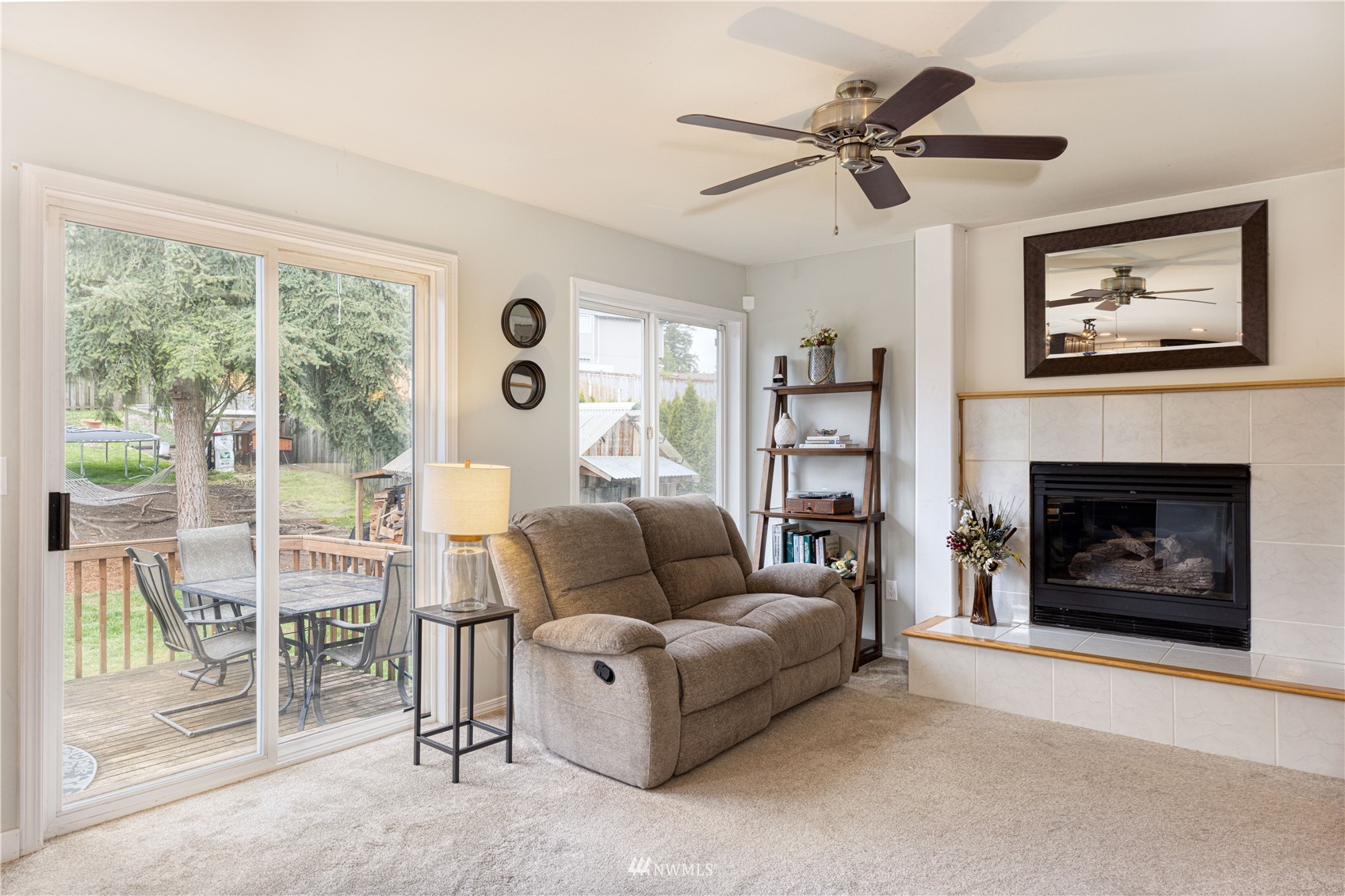 7414 Vandermark Road East Bonney Lake, WA 98391 - Photo 13 of 40 a living room with furniture and a fireplace
