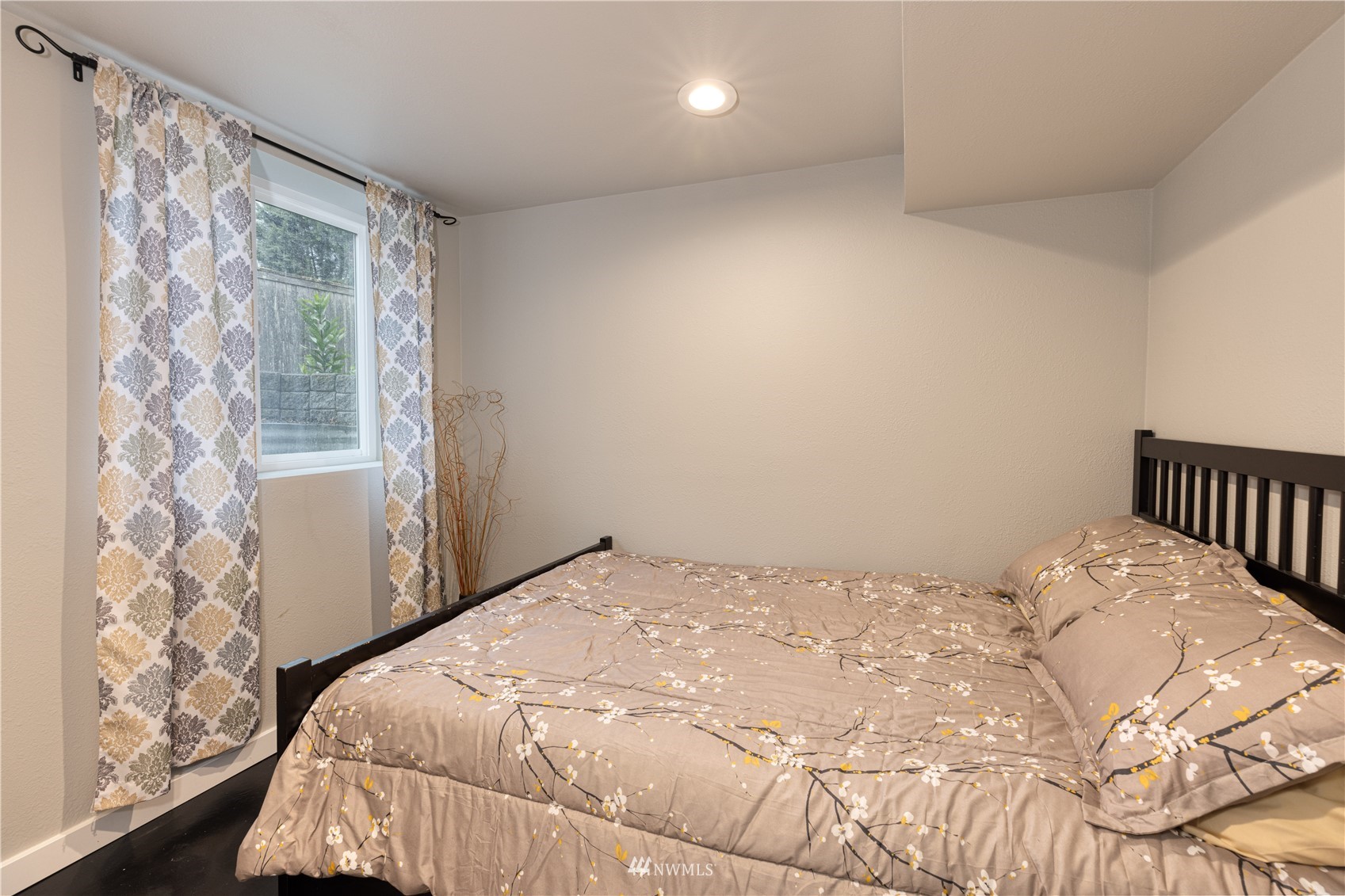7414 Vandermark Road East Bonney Lake, WA 98391 - Photo 21 of 40 a bedroom with a bed and a window