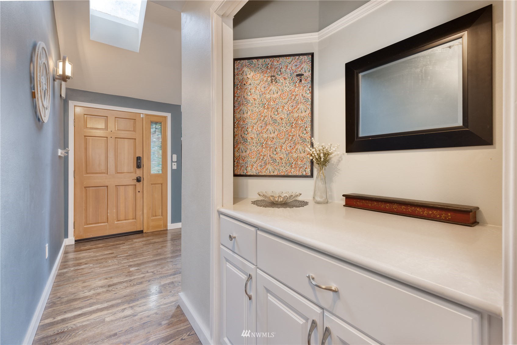 7414 Vandermark Road East Bonney Lake, WA 98391 - Photo 22 of 40 a view of hallway with wooden floor and cabinet