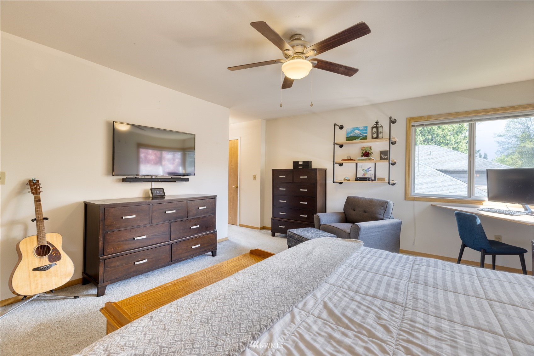 7414 Vandermark Road East Bonney Lake, WA 98391 - Photo 25 of 40 a bed room with a bed window and a television