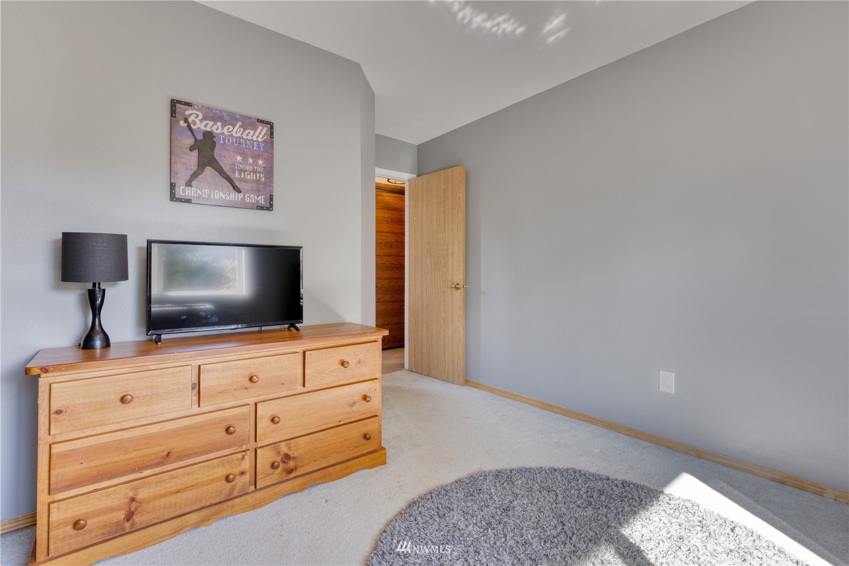 7414 Vandermark Road East Bonney Lake, WA 98391 - Photo 30 of 40 a living room with furniture and flat screen tv