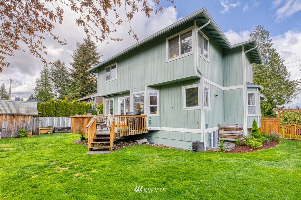 7414 Vandermark Road East Bonney Lake, WA 98391 - Photo 34 of 40 a view of a house with a backyard