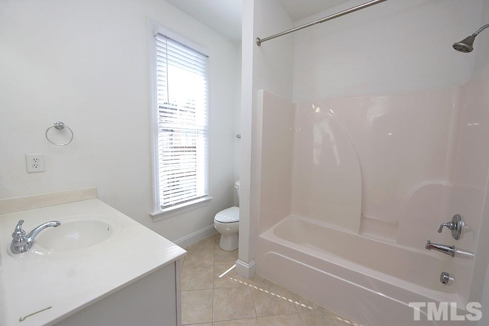 6111 Shandwick Court Raleigh, NC 27609 - Photo 13 of 17 a bathroom with a sink and a bathtub
