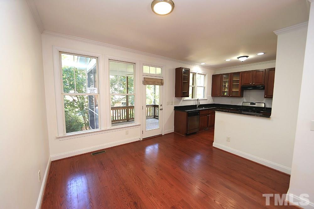 6111 Shandwick Court Raleigh, NC 27609 - Photo 7 of 17 a view of a kitchen with a sink cabinets and a window