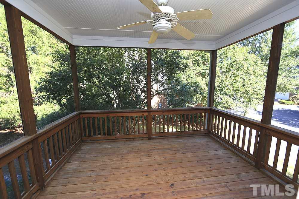 6111 Shandwick Court Raleigh, NC 27609 - Photo 8 of 17 a view of a porch with wooden floor